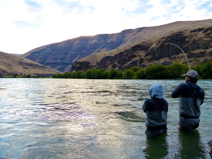 Zach with another fish on.